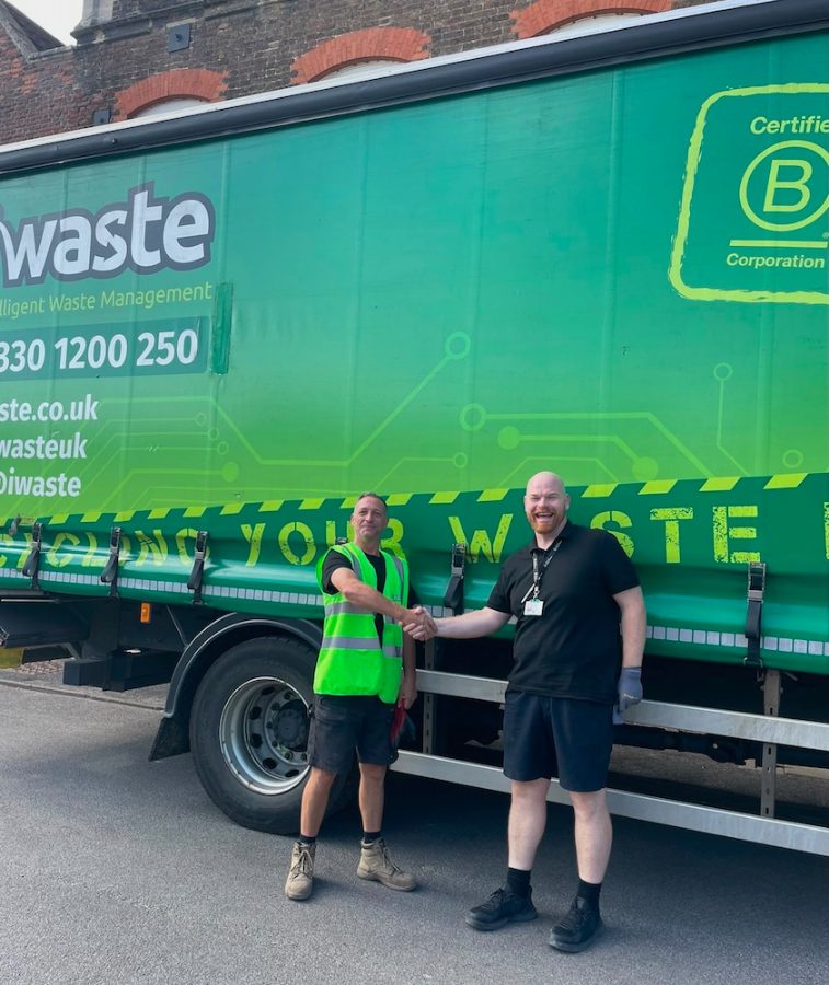 iWaste HGV Driver Gavin Costello hands over the stone at Hampton Court Palace